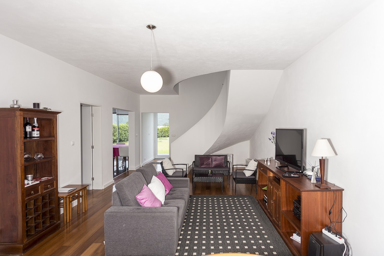 Casa das Camélias living room with sofas and staircase
